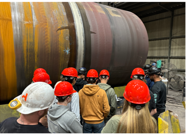 Group photo near excavator